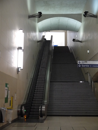 Steep stairs and escalator to exit