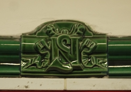 green North-South logo on ceramic tile
